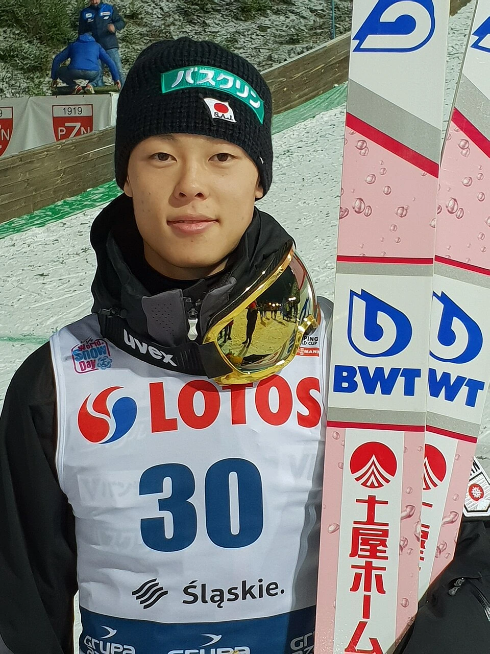 Japanese ski jumper Ryoyu Kobayashi posing with his skis at an event in Wisla, 2018
